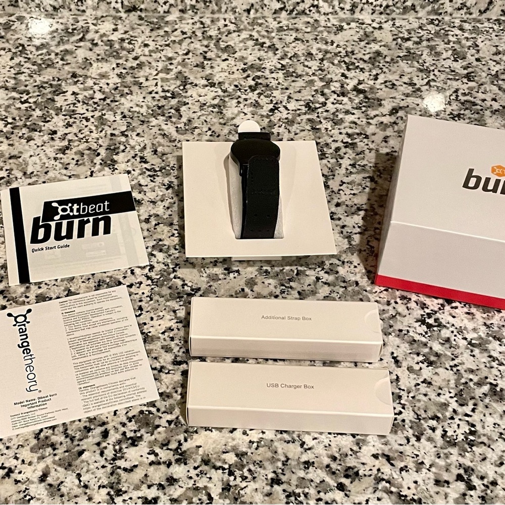 Orangetheory OT Beat Burn heart rate monitor with 2 black arm straps and charger